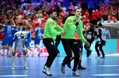 Croatia's goalkeeper #12 Matej Mandic (R) and Croatia's goalkeeper #43 Dino Slavic react after their team won the bronze medal in the men's EHF Euro 2026 third place handball match Iceland vs Croatia in Herning, Denmark, on February 1, 2026. (Photo by Jonathan Nackstrand/AFP)