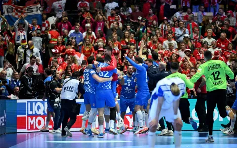 Croatia's players celebrate after their team won the bronze medal in the men's EHF Euro 2026 third place handball match Iceland vs Croatia in Herning, Denmark, on February 1, 2026. (Photo by Jonathan Nackstrand/AFP)