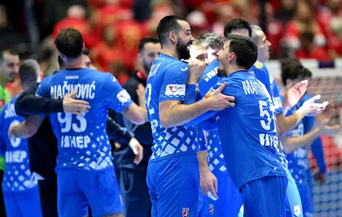 Croatia's players celebrate after their team won the bronze medal in the men's EHF Euro 2026 third place handball match Iceland vs Croatia in Herning, Denmark, on February 1, 2026. (Photo by Jonathan Nackstrand/AFP)