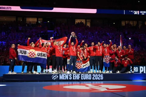 Croatia's players celebrate during the awarding ceremony after the team won bronze in the Men's EHF Euro 2026 finals in Herning, Denmark, on February 1, 2026. (Photo by Jonathan Nackstrand/AFP)