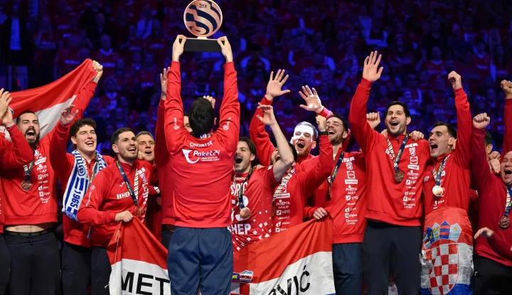 Croatia's players celebrate with the trophy during the awarding ceremony after the team won bronze in the Men's EHF Euro 2026 finals in Herning, Denmark, on February 1, 2026. (Photo by Jonathan Nackstrand/AFP)