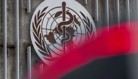(FILES) This photograph taken on April 23, 2025 shows a logo of the World Health Organisation (WHO) next to their headquarters in Geneva. The World Health Organization chief warned on January 13, 2026, that the Trump administration's decision to withdraw from the UN health agency was dangerous for the United States and the rest of the world alike. (Photo by Fabrice COFFRINI/AFP)