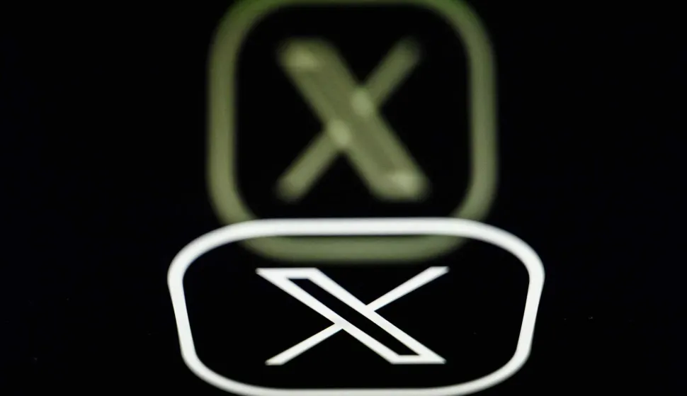 (FILES) This photograph taken on March 7, 2024 in Nantes, shows the logo of US social media platform X, formerly known as Twitter. A search is being carried out at the French offices of platform X by the cybercrime division of the Paris public prosecutor's office, the latter announced on February 3, 2026 on its social media accounts. (Photo by LOIC VENANCE/AFP)