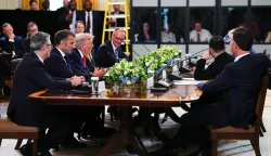 epa12308654 United States President Donald J Trump (C) makes remarks next to British Prime Minister Keir Starmer (L), French President Emmanuel Macron (2L) and German Chancellor Friedrich Merz (4L) during a Multilateral Meeting with European Leaders in the East Room of the White House in Washington, DC, USA, 18 August 2025. European Leaders are at the White House in support of President Zelenskyy following President Trump's meeting with President Vladimir Putin of Russia in Anchorage, Alaska, USA, on August 15, 2025. EPA/AARON SCHWARTZ/POOL