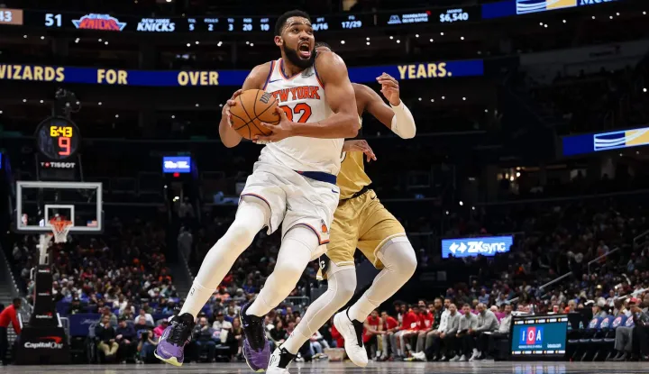 WASHINGTON, DC - FEBRUARY 03: Karl-Anthony Towns #32 of the New York Knicks drives to the basket against the Washington Wizards during the first half at Capital One Arena on February 3, 2026 in Washington, DC. NOTE TO USER: User expressly acknowledges and agrees that, by downloading and or using this photograph, User is consenting to the terms and conditions of the Getty Images License Agreement. Scott Taetsch/Getty Images/AFP (Photo by Scott Taetsch/GETTY IMAGES NORTH AMERICA/Getty Images via AFP)