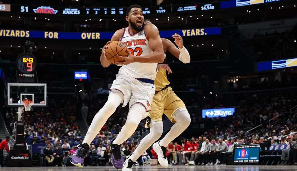 WASHINGTON, DC - FEBRUARY 03: Karl-Anthony Towns #32 of the New York Knicks drives to the basket against the Washington Wizards during the first half at Capital One Arena on February 3, 2026 in Washington, DC. NOTE TO USER: User expressly acknowledges and agrees that, by downloading and or using this photograph, User is consenting to the terms and conditions of the Getty Images License Agreement. Scott Taetsch/Getty Images/AFP (Photo by Scott Taetsch/GETTY IMAGES NORTH AMERICA/Getty Images via AFP)