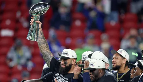 SANTA CLARA, CALIFORNIA - FEBRUARY 08: Abraham Lucas #72 of the Seattle Seahawks celebrates with the Vince Lombardi Trophy after winning Super Bowl LX against the New England Patriots at Levi's Stadium on February 08, 2026 in Santa Clara, California. The Seattle Seahawks defeated the New England Patriots 29-13. Chris Graythen/Getty Images/AFP (Photo by Chris Graythen/GETTY IMAGES NORTH AMERICA/Getty Images via AFP)