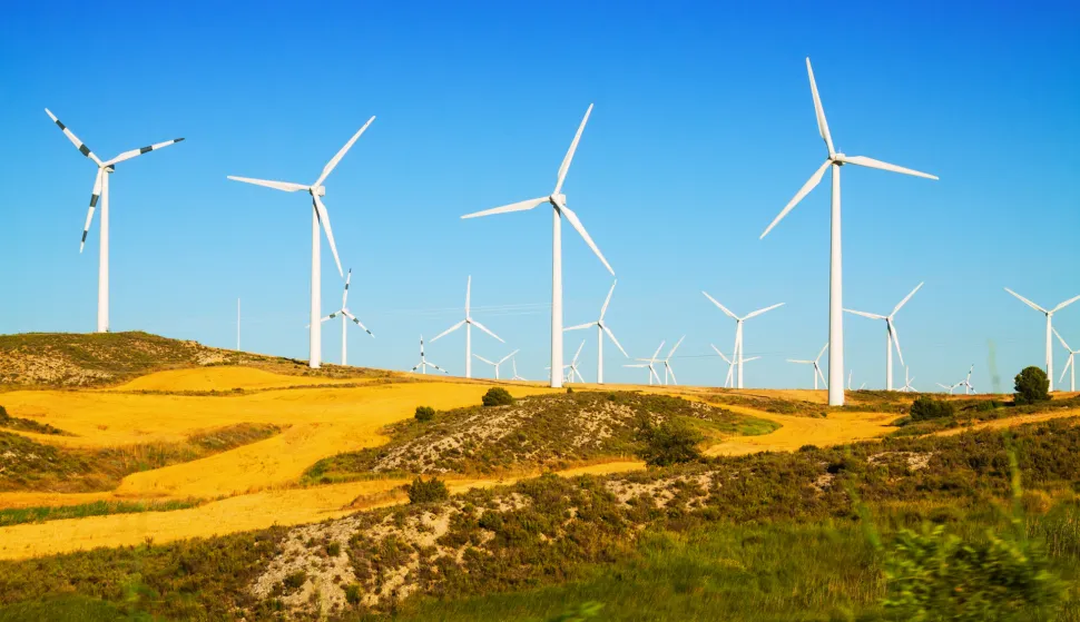 Wind farm at farmland. Aragon, Spain