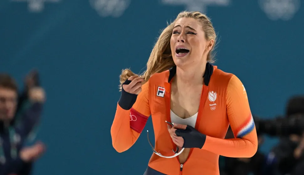 Netherlands' Jutta Leerdam reacts after winning gold in the speed skating women's 1000m during the Milano Cortina 2026 Winter Olympic Games at Milano Speed Skating Stadium in Milan on February 9, 2026. (Photo by Daniel MUNOZ/AFP)