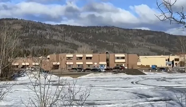 TOPSHOT - This screengrab of a video provided by local journalist Trent Ernst shows the middle school and high school building where a shooting took place, leaving at least nine people dead in the small town of Tumbler Ridge, British Columbia, on February 10, 2026. (Photo by Trent Ernst/AFP)/XGTY/RESTRICTED TO EDITORIAL USE - MANDATORY CREDIT "AFP PHOTO/Trent Ernst" - NO MARKETING NO ADVERTISING CAMPAIGNS - DISTRIBUTED AS A SERVICE TO CLIENTS