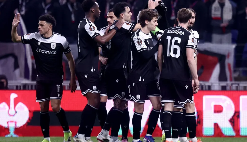 PAOK players celebrate after scoring a goal during the UEFA Europa League - League phase, Matchday 8 - football match between Olympique Lyonnais (OL) and PAOK FC at the Groupama Stadium in Lyon, central-eastern France, on January 29, 2026. (Photo by Alex MARTIN/AFP)