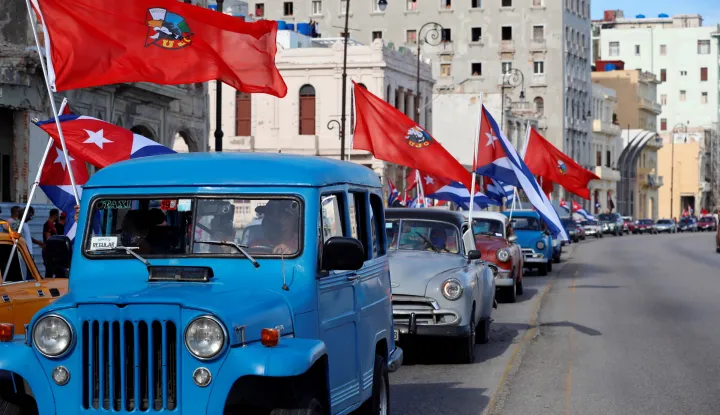 epa09398548 Classic cars participate in a march in support of the Cuban revolution through the Malecon area in Havana, Cuba, 05 August 2021. Cubans took to the streets in Cuba on 11 July to protest the government response to the COVID-19 pandemic, shortages of medicines and basic commodities, and decliing infrustructure on the island nation. EPA/Ernesto Mastrascusa