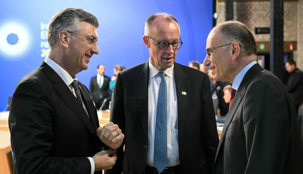 (From L) Croatia's Prime Minister Andrej Plenkovic, Germany's Chancellor Friedrich Merz and Former Prime Minister of Italy Enrico Letta talk ahead of a working session during the Informal EU Leaders' Retreat at the Alden Biesen Castle, in Rijkhoven on February 12, 2026. (Photo by NICOLAS TUCAT/POOL/AFP)
