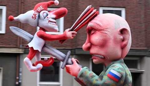 A carnival float designed by German carnival float builder Jacques Tilly featuring Russian President Vladimir Putin is pictured during the parade to celebrate Rose Monday (Rosenmontag), on February 16, 2026 in Duesseldorf, western Germany. (Photo by INA FASSBENDER/AFP)