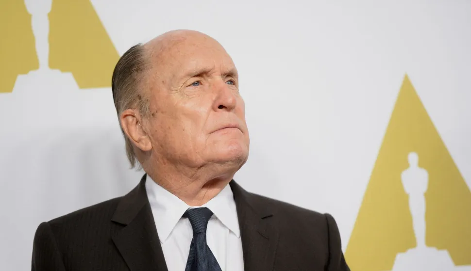 (FILES) Actor Robert Duvall arrives for the Oscars Nominees' Luncheon hosted by the Academy of Motion Picture Arts and Sciences, February 2, 2015 at the Beverly Hilton Hotel in Beverly Hills, California. Robert Duvall, who played the smooth mafia lawyer in "The Godfather" and stole the show with his depiction of a surfing-crazed colonel in "Apocalypse Now," has died at the age of 95, his wife said on February 16, 2026. (Photo by Robyn BECK/AFP)