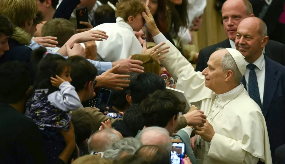 Pope Leo XIV blesses a baby during weekly general audience, at Paul-VI hall in The Vatican on February 4, 2026. (Photo by Filippo MONTEFORTE/AFP)