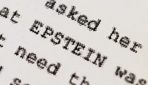 CHICAGO, ILLINOIS - FEBRUARY 13: In this photo illustration, a page printed from the Epstein files released by the Department of Justice (DOJ) is shown on February 13, 2026 in Chicago, Illinois. The DOJ has published nearly 3.5 million documents, many heavily redacted, and more than 2,000 videos and 180,000 images to comply with the Epstein Files Transparency Act. (Photo Illustration by Scott Olson/Getty Images) (Photo by SCOTT OLSON/GETTY IMAGES NORTH AMERICA/Getty Images via AFP)