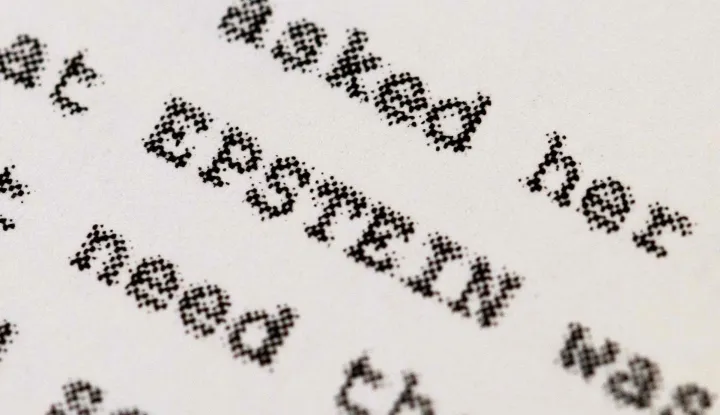 CHICAGO, ILLINOIS - FEBRUARY 13: In this photo illustration, a page printed from the Epstein files released by the Department of Justice (DOJ) is shown on February 13, 2026 in Chicago, Illinois. The DOJ has published nearly 3.5 million documents, many heavily redacted, and more than 2,000 videos and 180,000 images to comply with the Epstein Files Transparency Act. (Photo Illustration by Scott Olson/Getty Images) (Photo by SCOTT OLSON/GETTY IMAGES NORTH AMERICA/Getty Images via AFP)