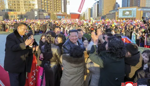 This picture taken on February 16, 2026 and released by North Korea's official Korean Central News Agency (KCNA) on February 17, 2026 shows North Korean leader Kim Jong Un (C) congratulating residents moving into their new homes at the inauguration ceremony of 10,000 flats at fourth stage in Hwasong area of Pyongyang. (Photo by KCNA VIA KNS/AFP)/South Korea OUT/---EDITORS NOTE--- RESTRICTED TO EDITORIAL USE - MANDATORY CREDIT "AFP PHOTO/KCNA VIA KNS" - NO MARKETING NO ADVERTISING CAMPAIGNS - DISTRIBUTED AS A SERVICE TO CLIENTSTHIS PICTURE WAS MADE AVAILABLE BY A THIRD PARTY. AFP CAN NOT INDEPENDENTLY VERIFY THE AUTHENTICITY, LOCATION, DATE AND CONTENT OF THIS IMAGE./