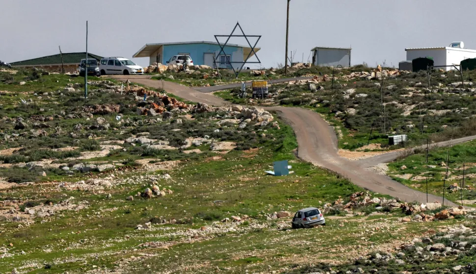 TOPSHOT - A large installation depicting a Star of David symbol is displayed at an Israeli settlement outpost on a hill by the Palestinian village of Beit Awa in the southwest of the occupied West Bank on February 11, 2026. (Photo by HAZEM BADER/AFP)