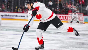(FILES) Canada's forward #09 Nathan Mackinnon shoots to score 1-1 during the IIHF Men's Ice Hockey World Championship Group A match between Canada and Austria at the Avicii Arena in Stockholm, on May 15, 2025. With ice rink concerns resolved just weeks before the opening faceoff, National Hockey League stars return to the Winter Olympics in Milan-Cortina for the first time since 2014.The world?s top players will compete in Italy after the elite North American league agreed to a midseason shutdown, and issues of ice quality and rink size were sorted out in January. (Photo by Jonathan NACKSTRAND/AFP)