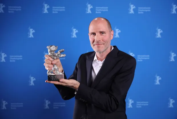 US director Lance Hammer poses during a photocall after winning the Silver Bear Jury Prize for the movie "Queen at Sea" at the 76th Berlinale, Europe's first major film festival of the year, in Berlin on February 21, 2026. The 76th Berlin Film Festival draws to a close after 10 days, with 22 films in competition. (Photo by Ronny HARTMANN/POOL/AFP)