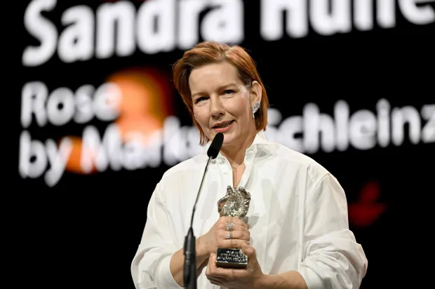 German actress Sandra Hueller accepts the Silver Bear for Best Leading Performance during the Award Ceremony of the 76th Berlinale, Europe's first major film festival of the year, in Berlin on February 21, 2026. The 76th Berlin Film Festival draws to a close after 10 days, with 22 films in competition. (Photo by RALF HIRSCHBERGER/AFP)