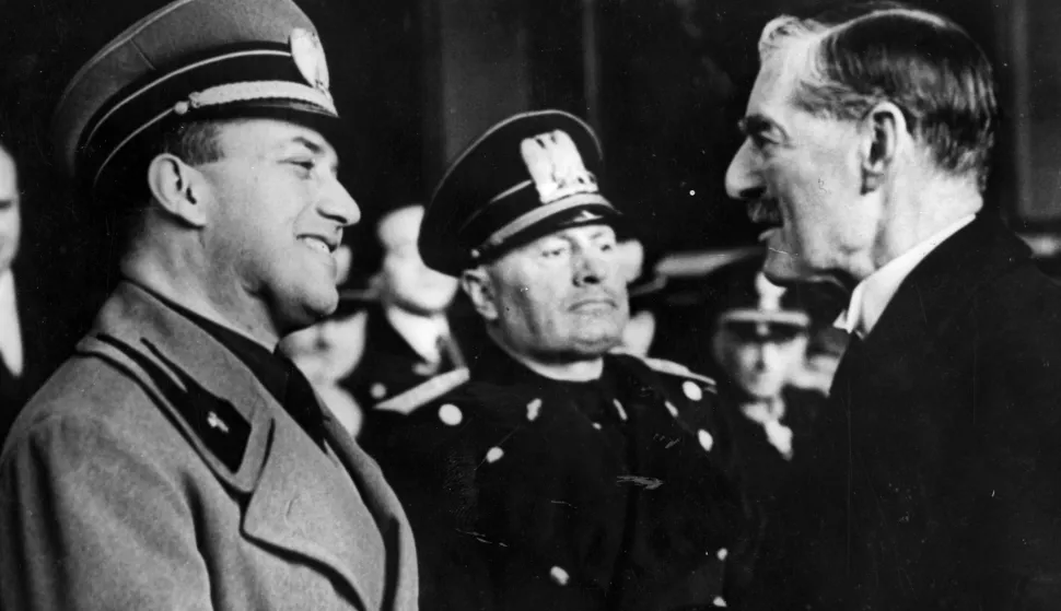 FILE - This is a January 14, 1939 file photo showing Italian Prime Minister Benito Mussolini. standing between Italian Foreign Minster Count Galeazzo Ciano and British Prime Minister Sir Neville Chamberlain, right, at the Termini railway station in Rome.  A historian says Benito Mussolini was well paid as a British agent during World War I. The Guardian newspaper reported Wednesday Oct. 14, 2009 that Peter Martland of Cambridge University discovered that Mussolini was paid 100 pounds a week by Britain in 1917 equal to about 6,000 pounds (US$9,600) today. (AP Photo, File, File)
