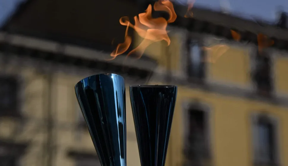 TOPSHOT - A picture shows the Olympic flame during the torch relay ahead of the Milano Cortina 2026 Winter Olympic Games, in Milan on February 6, 2026. (Photo by Daniel MUNOZ/AFP)