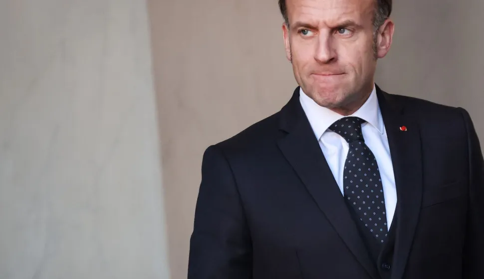 France's President Emmanuel Macron reacts as he waits for the arrival of Chiefs of State at the Elysee Palace in Paris, on January 6, 2026, prior to the Coalition of the Willing summit on security guarantees for Ukraine. The summit of the group of Ukraine supporters dubbed the "Coalition of the Willing" is the latest of several meetings planned for the new year as diplomatic efforts to end Europe's deadliest conflict since World War II have gained pace in recent weeks. (Photo by Ludovic MARIN/AFP)