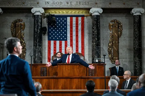 TOPSHOT - US President Donald Trump delivers the first State of the Union address of his second term to a joint session of Congress in the House Chamber of the United States Capitol in Washington, DC, on February 24, 2026. (Photo by Kenny HOLSTON/POOL/AFP)
