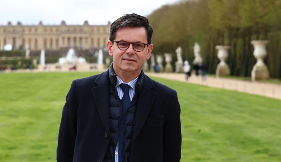 (FILES) Head of the Chateau de Versailles domain, Christophe Leribault, poses for photographs, on the sidelines of a media tour of the Paris 2024 Olympic and Paralympic venue infrastructure in Versailles, southwest of Paris, on March 29, 2024. The current president of the Palace of Versailles, Christophe Leribault, is tipped to take over the Louvre after the resignation of Laurence des Cars, a source within the executive told AFP on February 25, 2026, confirming a report by Le Parisien. (Photo by EMMANUEL DUNAND/AFP)