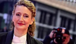 (FILES) Berlinale director Tricia Tuttle arrives on the red carpet for the Award Ceremony of the 76th Berlinale, Europe's first major film festival of the year, in Berlin on February 21, 2026. German government officials will on February 26, 2026 summon organisers of the Berlin film festival, which was rocked this year by controversy over the Israel-Palestinian conflict and Gaza war. Bild daily reported that Tricia Tuttle, the US director of the Berlinale, is expected to be sacked at the meeting, citing sources close to the KBB state-owned company that runs the festival. (Photo by John MACDOUGALL/AFP)