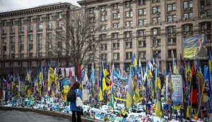 A local resident visits a makeshift memorial for Ukrainian and foreign soldiers in Independence Square in Kyiv on February 24, 2026, on the fourth anniversary of Russia?s invasion of Ukraine. (Photo by HENRY NICHOLLS/AFP)