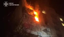 This handout photograph taken and released by the State Emergency Service of Ukraine on February 26, 2026 shows a residential building burning following a Russian drone attack in Zaporizhzhia, amid the Russian invasion of Ukraine. Russian strikes in multiple Ukraine cities wounded 23 people including a child, officials said on February 26, ahead of talks between Ukrainian and US negotiators in Geneva aimed at ending Moscow's war. (Photo by Handout/State Emergency Service of Ukraine/AFP)/RESTRICTED TO EDITORIAL USE - MANDATORY CREDIT "AFP PHOTO/State Emergency Service of Ukraine" - NO MARKETING NO ADVERTISING CAMPAIGNS - DISTRIBUTED AS A SERVICE TO CLIENTS