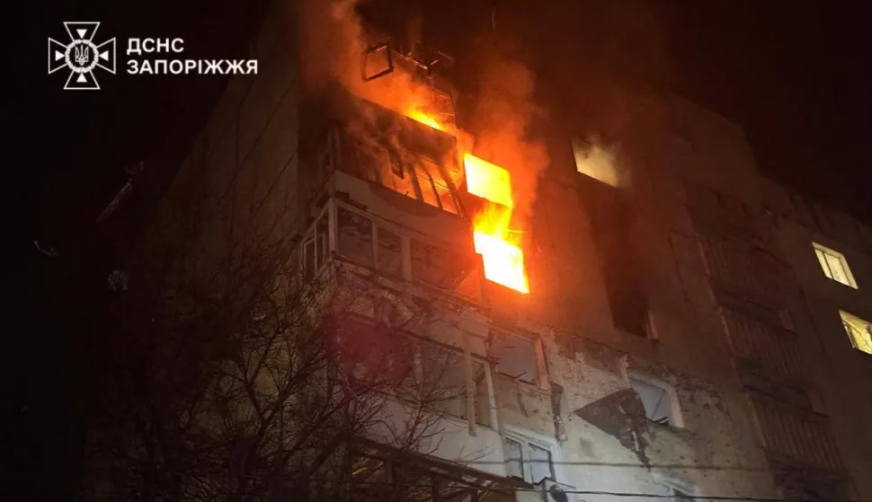 This handout photograph taken and released by the State Emergency Service of Ukraine on February 26, 2026 shows a residential building burning following a Russian drone attack in Zaporizhzhia, amid the Russian invasion of Ukraine. Russian strikes in multiple Ukraine cities wounded 23 people including a child, officials said on February 26, ahead of talks between Ukrainian and US negotiators in Geneva aimed at ending Moscow's war. (Photo by Handout/State Emergency Service of Ukraine/AFP)/RESTRICTED TO EDITORIAL USE - MANDATORY CREDIT "AFP PHOTO/State Emergency Service of Ukraine" - NO MARKETING NO ADVERTISING CAMPAIGNS - DISTRIBUTED AS A SERVICE TO CLIENTS