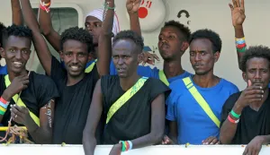 epa06951272 Migrants on board the SOS Mediterranee NGO rescue vessel MV Aquarius react as the vessel enters the Grand Harbour in Senglea, Valletta, Malta, 15 August 2018. The migrant rescue ship was allowed to dock in Malta on the day after days at sea with some 141 migrants on board - who were rescued off the Libyan coast Libya on 10 August - and since then turned away from Italian ports, media reported. Malta reached an agreement with Germany, Spain, Portugal, France and Luxembourg to allow the ship to dock before sending the migrants to the five countries. EPA/DOMENIC AQUILINA