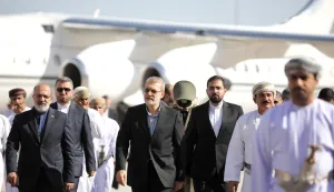 This photo released by Iran's Supreme National Security Council office shows Secretary of the Supreme National Security Council Ali Larijani (C) arriving in Muscat, Oman on February 10, 2026. Iran's top security official met Oman's ruler in Muscat on February 10, days after a new round of talks there between officials from Washington and Tehran. Ali Larijani, who heads the Supreme National Security Council, and Sultan Haitham bin Tariq "discussed the latest developments in the Iranian-American negotiations", the official Oman News Agency said. (Photo by HANDOUT/Iran's Supreme National Security/AFP)
