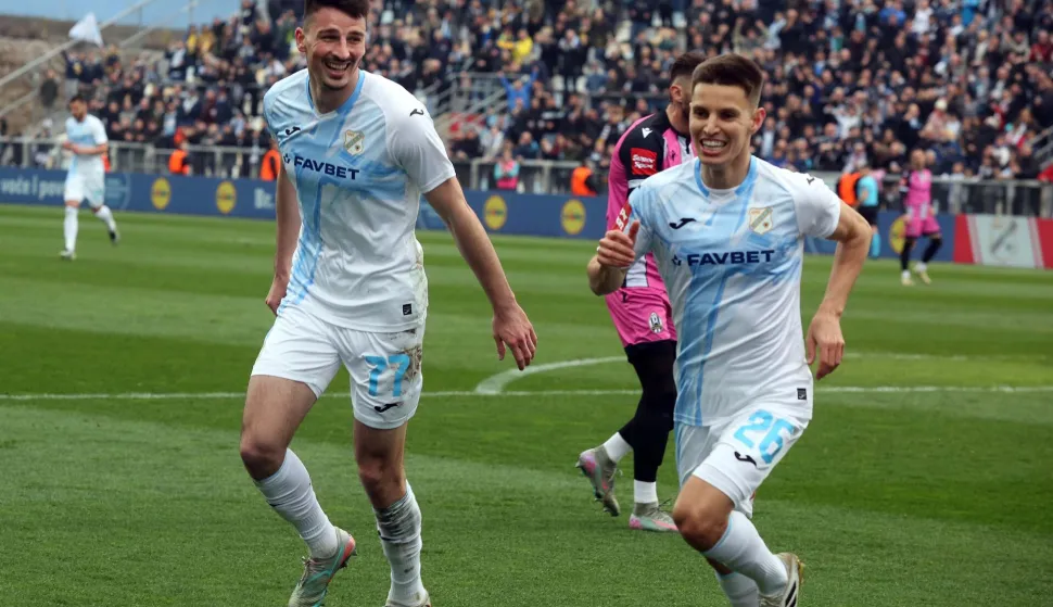 Rijeka,01.03.2026.- U 24. kolu SDuperSport HNL a na Rujevici igraju Rijeka i Lokomotiva. Na fotografiji strijelac gola za Rijeku Oliveira Dantas Tiago Filipe (D) i Ante Mate Jurić.