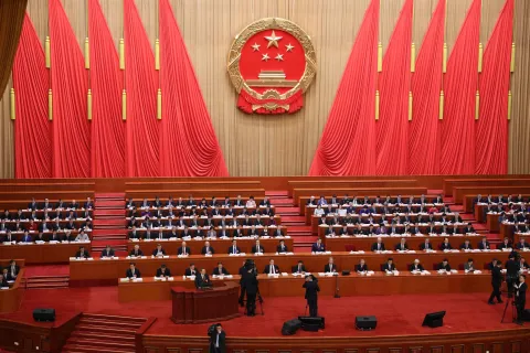 Chinese Premier Li Qiang delivers a work report during the opening session of the National People's Congress (NPC) at the Great Hall of the People in Beijing on March 5, 2026. (Photo by Florence Lo/POOL/AFP)