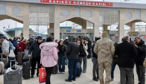 Iranian nationals arrive in northeastern Turkey after passing through the Razi-Kapikoy border crossing in Van, on March 2, 2026 as Turkey and Iran have mutually suspended day-trip crossings at their border, Turkey's trade minister said as Israeli-US strikes continued to pound the Islamic Republic. (Photo by Ali IHSAN OZTURK/AFP)