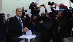 epa05629387 Rumen Radev, Presidential candidate of Initiative Committee, formally supported by the Bulgarian Socialist Party (BSP) casts his vote in the second round of Presidential elections in Bulgaria, at a polling station in Sofia, Bulgaria, 11 November 2016. Some 6.8 million Bulgarians vote in a runoff for a new president of EU member state on the Balkans. The vote will also decide the future of the center-right government in Sofia. Prime Minister Boyko Borisov said his cabinet would resign if the candidate of his GERB party, Tsetska Tsatcheva, lost the runoff. In the first round of voting on November 06, the candidate of the oppositional Socialist Party, the former general Roumen Radev, came in first. EPA/VASSIL DONEV
