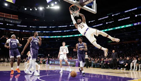 LOS ANGELES, CALIFORNIA - MARCH 01: LeBron James #23 of the Los Angeles Lakers makes a slam dunk against the Sacramento Kings in the second half at Crypto.com Arena on March 01, 2026 in Los Angeles, California. NOTE TO USER: User expressly acknowledges and agrees that, by downloading and or using this photograph, User is consenting to the terms and conditions of the Getty Images License Agreement. Ronald Martinez/Getty Images/AFP (Photo by RONALD MARTINEZ/GETTY IMAGES NORTH AMERICA/Getty Images via AFP)