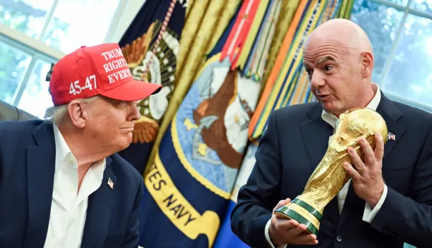 epa12317162 FIFA President Gianni Infantino (R) hands US President Donald Trump (L) the FIFA World Cup trophy after announcing the 2026 FIFA World Cup draw will be held at the Kennedy Center in December 2025, in the Oval Office of the White House in Washington, DC, USA, 22 August 2025. The 2026 FIFA World Cup, coming to North America next summer will be the first World Cup with three host countries in the U.S., Canada and Mexico, and it will be the first to feature a 48-team field. EPA/ANNABELLE GORDON/POOL