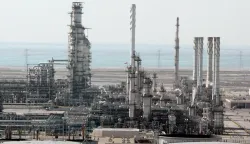 (FILES) A general view shows Ras Tannura's oil production plant near Dammam in Saudi Arabia's eastern province, 27 December 2004. Saudi oil refinery, Ras Tanura, along the Gulf coast was targeted in an attack on March 2, 2026, a source familiar with the incident told AFP, as Iran launched a fresh barrage at countries across the region. (Photo by BILAL QABALAN/AFP)