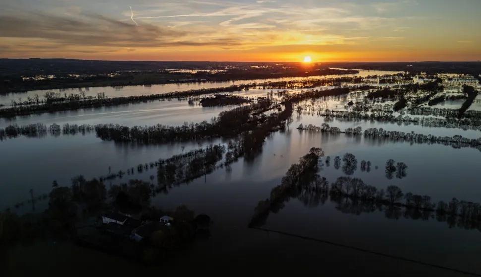 This aerial view shows flood water following severe flooding from storm Nils in Champtoc? sur Loire, south-western France, on February 24, 2026. (Photo by Philippe LOPEZ/AFP)