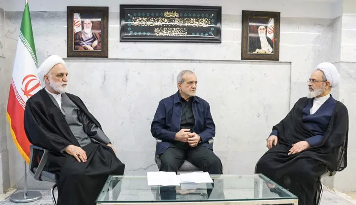 TOPSHOT - A handout photo made available by the state television station, Islamic Republic of Iran Broadcasting News (IRIBNEWS) on March 2, 2026, show The second meeting of the Interim Leadership Council attended by President Masoud Pezhakian (C) Judiciary Chief Gholamhossein Mohseni Ejei (L) and Alireza Aarafi (R), a member of the Guardian Council's jurist, in Tehran. The United States and Israel launched strikes against Iran, killing the Iranian supreme leader, with the Islamic republic retaliating with barrages of missiles at Gulf states and Israel on February 28, 2026. (Photo by Handout/IRIBNEWS/AFP)/RESTRICTED TO EDITORIAL USE - MANDATORY CREDIT "AFP PHOTO/Islamic Republic of Iran Broadcasting News (IRIBNEWS)" - HANDOUT - NO MARKETING NO ADVERTISING CAMPAIGNS - DISTRIBUTED AS A SERVICE TO CLIENTS