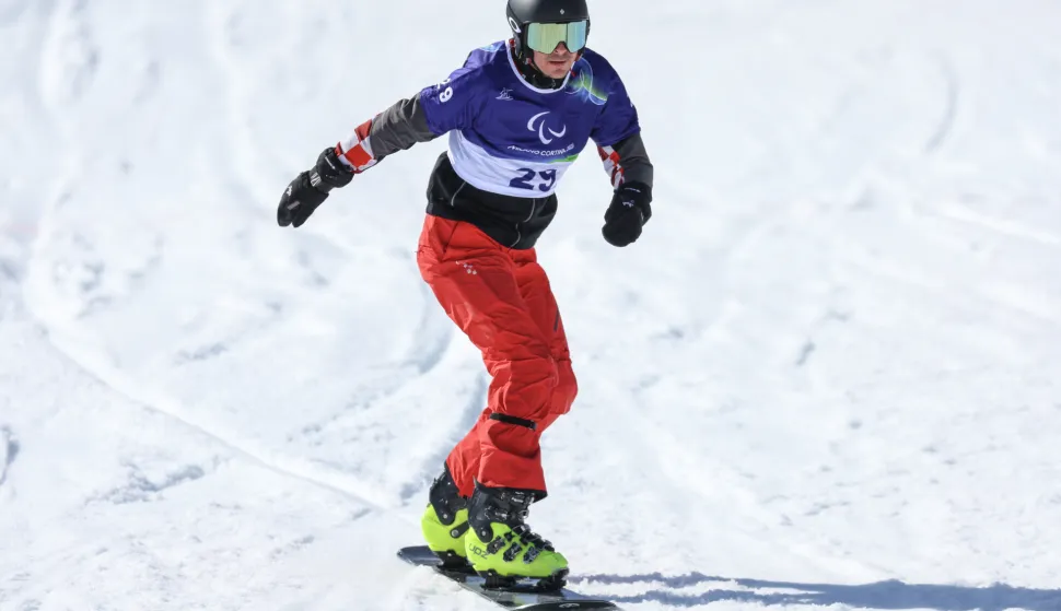 Cortina d'Ampezzo, 07.03.2026 - Hrvatski paraolimpijac Bruno Bo&scaron;njak tijekom kvalifikacijske utrke Snowboard Cross na Paraolimpijskim igrama Milano-Cortina 2026.foto HINA/ Damir SENČAR/ ds