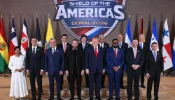 TOPSHOT - US President Donald Trump (C) stands with, (L/R), Trinidad and Tobago's Prime Minister Kamla Persad-Bissessar, Santiago Pe?a, President of the Republic of Paraguay, Luis Abinader, President of the Dominican Republic, Rodrigo Paz Pereira, President of Bolivia, Nayib Bukele, President of El Salvador, Javier Milei, President of Argentina, Jos? Ra?l Mulino, President of Panama, Mohamed Irfaan Ali, President of Guyana, Nasry ?Tito? Asfura, President of Honduras, Rodrigo Chaves Robles, President of Costa Rica, Jos? Antonio Kast, President-elect of Chile, and Daniel Roy Gilchrist Noboa Az?n, President of Ecuador, during a group photograph at the start of the "Shield of the Americas" Summit at Trump National Doral in Miami, Florida, March 7, 2026. President Trump is hosting a dozen right-wing leaders from Latin America and the Caribbean to discuss issues facing the region, from organized crime to illegal immigration. The summit also aims to serve Washington by boosting US interests in the region and curbing those from foreign powers like China. (Photo by SAUL LOEB/AFP)