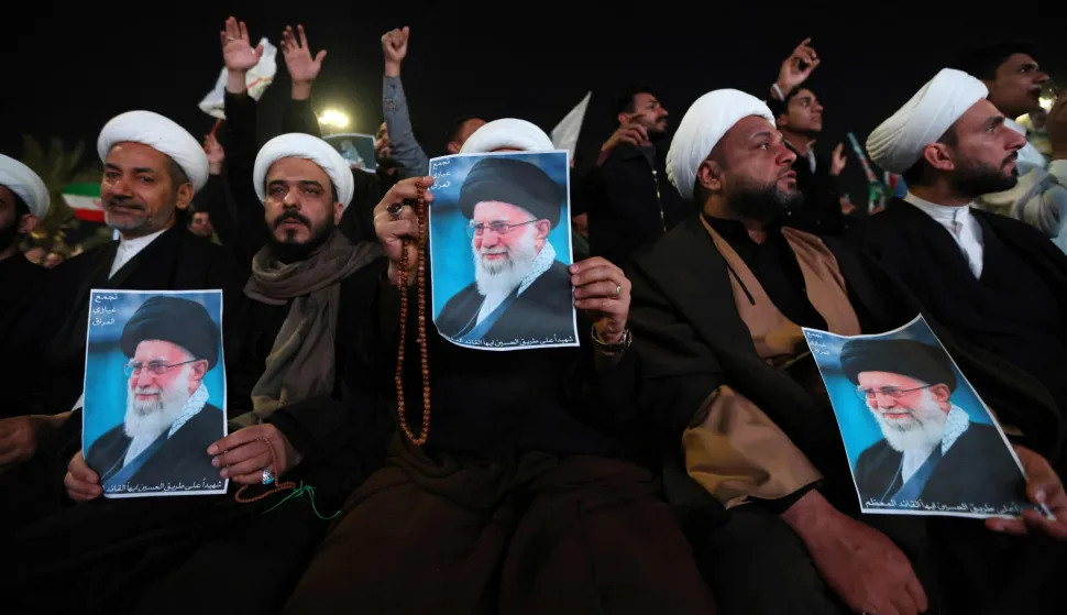 Shiite Muslim clerics hold posters of the late Iranian supreme leader Ayatollah Ali Khamenei, assassinated in a US- Israeli attack on Tehran, as they rally in Tahrir Square, in the Baghdad on March 6, 2026. The United States and Israel launched strikes against Iran on February 28, killing Iran's supreme leader and top military leaders, prompting authorities to retaliate with strikes on Israel and across the Gulf. Fresh strikes rocked Iran and Lebanon on March 6, as Israel and the United States stepped up their attacks in the sprawling Middle East war, with powerful explosions shattering the skies of Tehran. (Photo by Murtaja LATEEF/AFP)